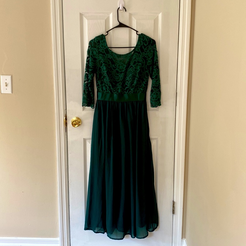 It’s a beautiful dark green dress with half sleeves.